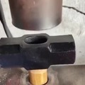 Pressing a sledgehammer