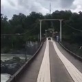 Guy falls from quad on a bridge and disappears