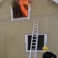 Firefighter putting out a fire using Bernoulli's principle