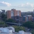 A C-17 flying in between of building & skyscrapers in Brisbane!