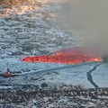 Excavator operator trying to stop the lava
