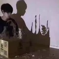 Making shadow art with pieces of cardboard