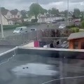 Police is being chased out of the neighborhood by a guy with a chainsaw in the UK