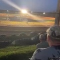 Racecar almost crashes into spectators in grandstand