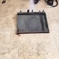Pressure washing a radiator