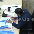 Election officer tampering with votes realizes that there's a CCTV camera right above him