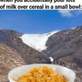 Milk over cereal in a small bowl