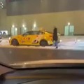 Woman kick a cab and then continue to get in it