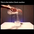 A chemical reaction where 2 clear solutions are mixed together and suddenly turn dark blue or black